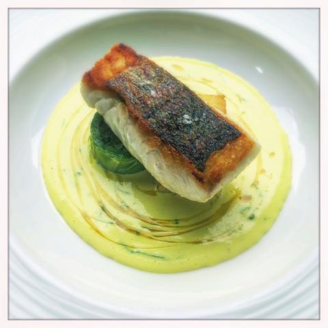 Cornish Hake, curry sauce, cabbage and coriander by Tom Brown, head chef at Michelin starred Outlaws at the Capital