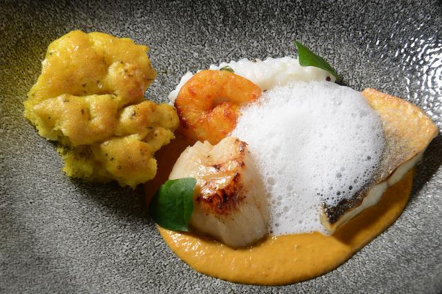 Scallops sea bass, shirmps, coconut rice risotto, lobster ghee, curry lead bread