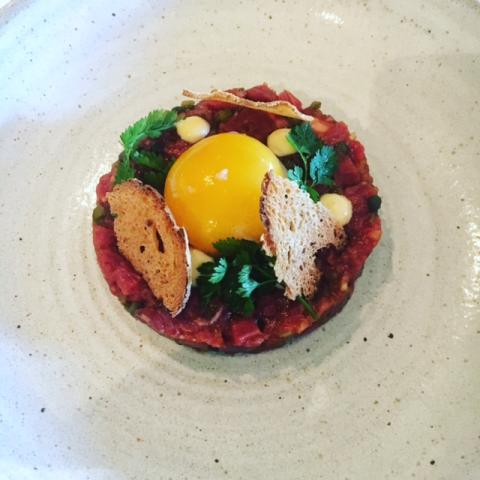 Irish Grassfed beef Tartar, Confit yolk, Cajun ketchup, and Toasted sourdough at Chapter One