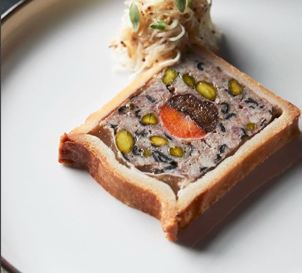 Duck and Guineafowl ‘En Croute’ a terrine of duck%2C guineafowl%2C pistachios and trompette mushrooms set in Kampot pepper infused jelly with a carrot and prune centre. Served with celeriac remoulade