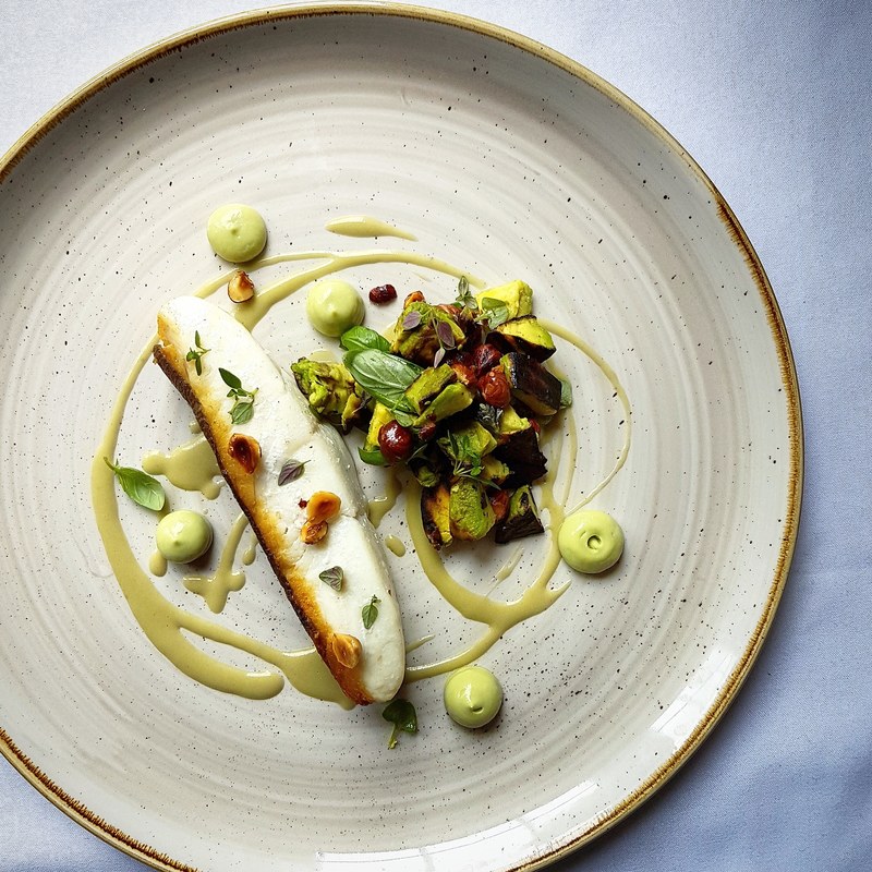 Halibut fillet with charred avocado, hazelnut, and soft herb salad, pita bread and soft herb sauce by chef Kareem Roberts, chefs to follow on Instagram, food pics, social media, The Staff Canteen, Instagram Top Ten