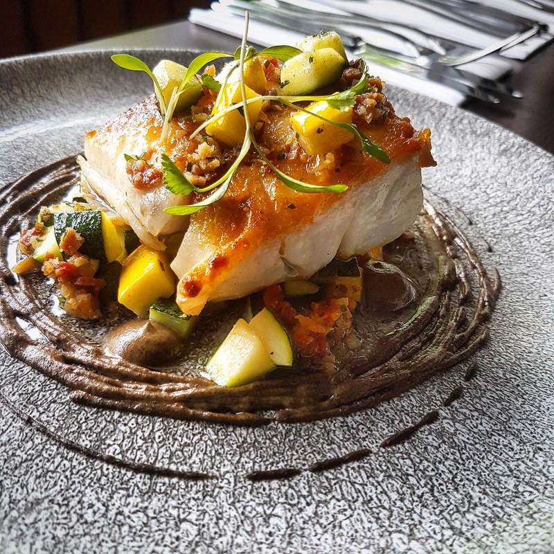 Seared cod, roasted aubergine puree, courgettes, and bacon salsa by chef Kareem Roberts, chefs to follow on Instagram, food pics, social media, The Staff Canteen, Instagram Top Ten