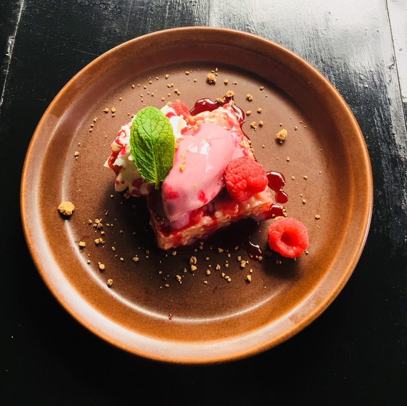 Homemade raspberry krispy treats, raspberry sorbet, fresh raspberries, raspberry reduction finish with roasted with chocolate crumbs by chef Ramon Tomasini, F&D Kitchen and Bar, Florida