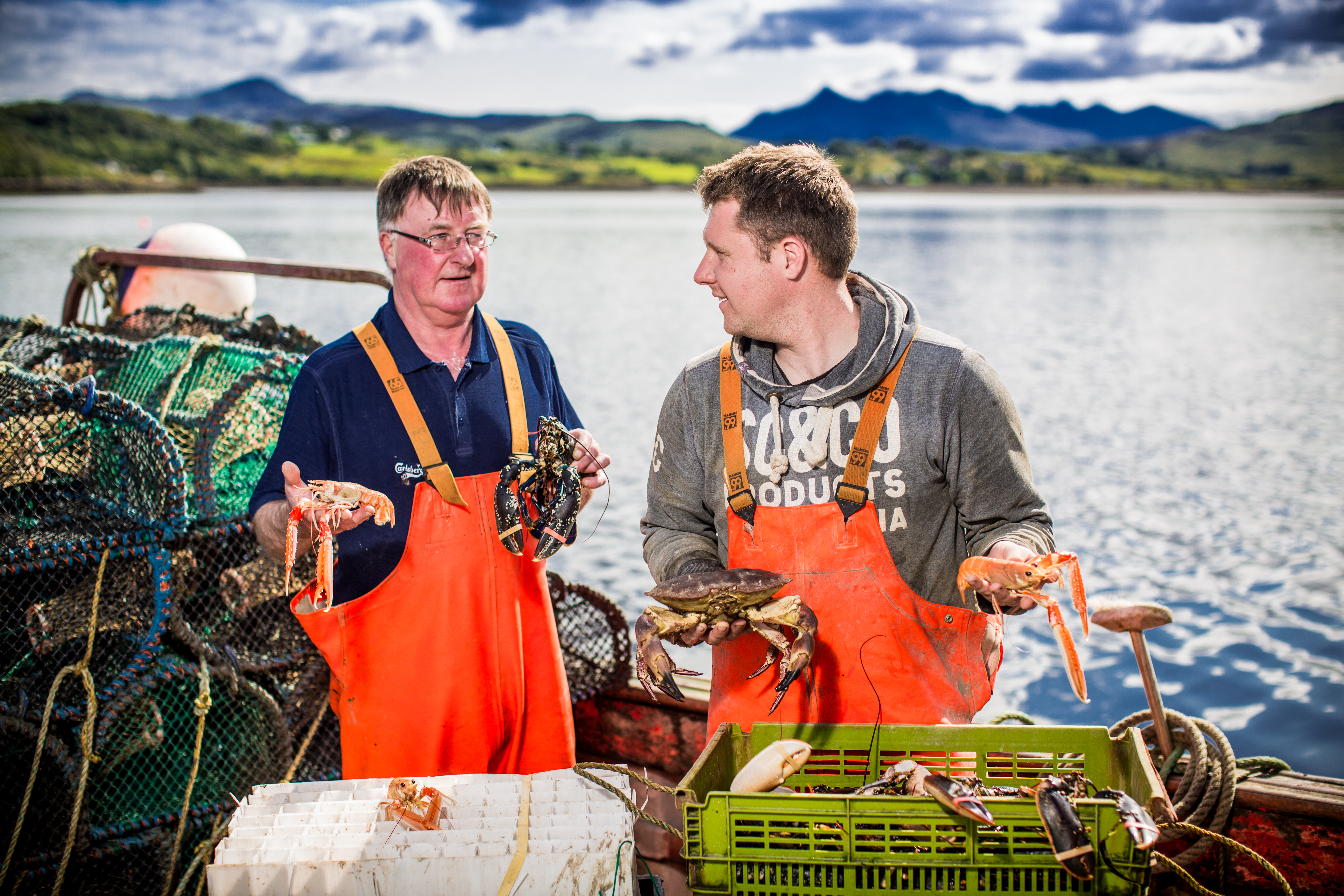 Skipper Ewen Grant with catch of Scottish langoustine and lobster 